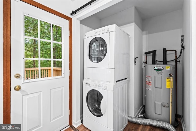 65 Wades Run, Mineral, VA 23117 - laundry room with electric water heater, estacked washer and dryer, baseboards, and wood finished floors