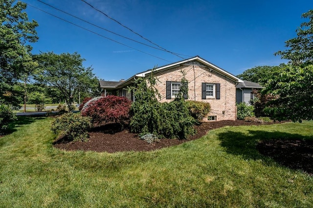 404 3rd St, Grottoes, VA 24441 - view of home's exterior featuring a lawn and brick siding