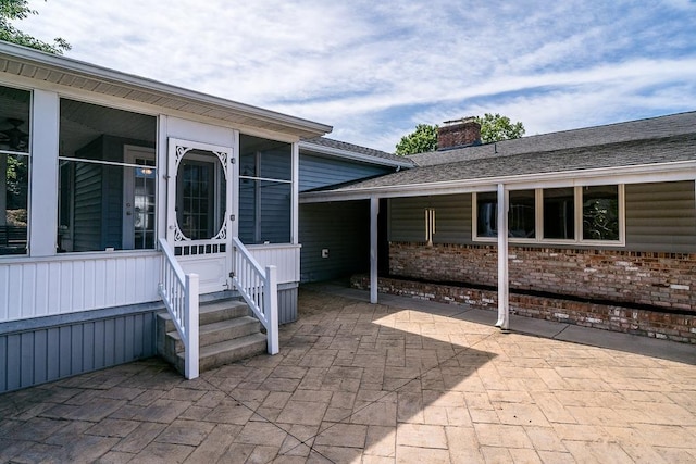 404 3rd St, Grottoes, VA 24441 - property entrance featuring a chimney and a patio