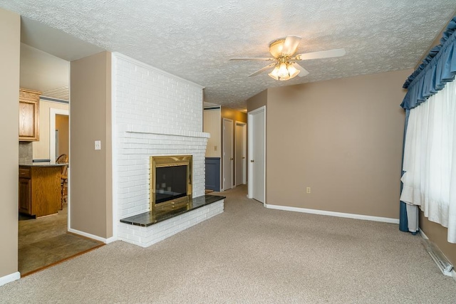 404 3rd St, Grottoes, VA 24441 - unfurnished living room with carpet, ceiling fan, a brick fireplace, a textured ceiling, and baseboards