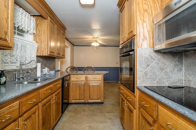 404 3rd St, Grottoes, VA 24441 - kitchen featuring black appliances, a sink, brown cabinets, and ceiling fan