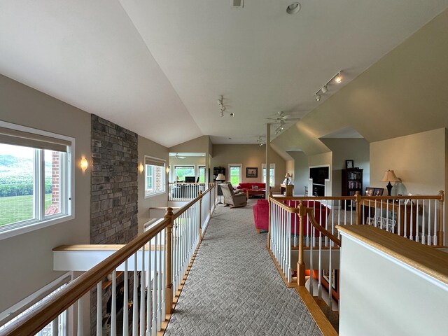 603 Dabneys Rd, Raphine, VA 24472 - hall featuring rail lighting, a wealth of natural light, an upstairs landing, and vaulted ceiling
