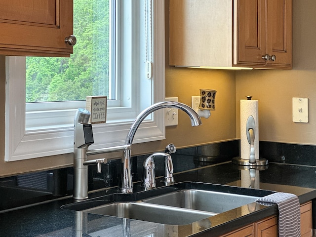 603 Dabneys Rd, Raphine, VA 24472 - room details featuring dark countertops, brown cabinetry, and a sink