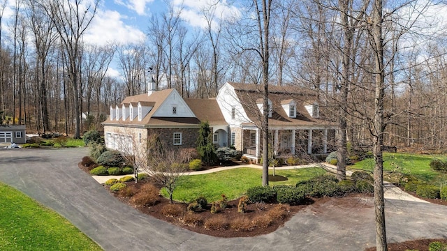 1767 Goose Creek Rd, Waynesboro, VA 22980 - view of front facade with stone siding, a front lawn, asphalt driveway, and a garage