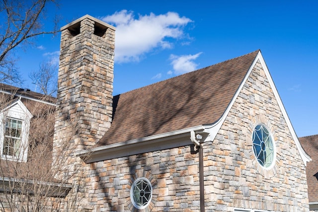 1767 Goose Creek Rd, Waynesboro, VA 22980 - exterior view of a chimney, a downspout, stone siding, gutters, and roof with shingles