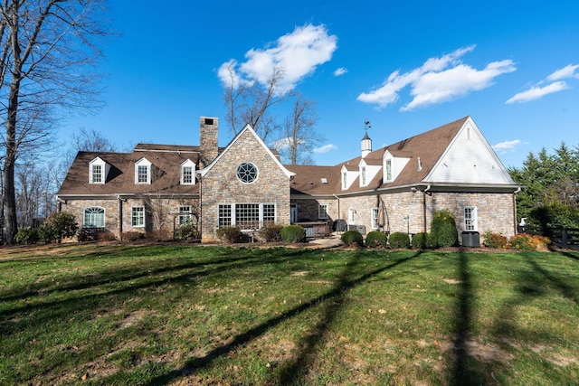 1767 Goose Creek Rd, Waynesboro, VA 22980 - back of property with stone siding, a chimney, a lawn, and central AC unit