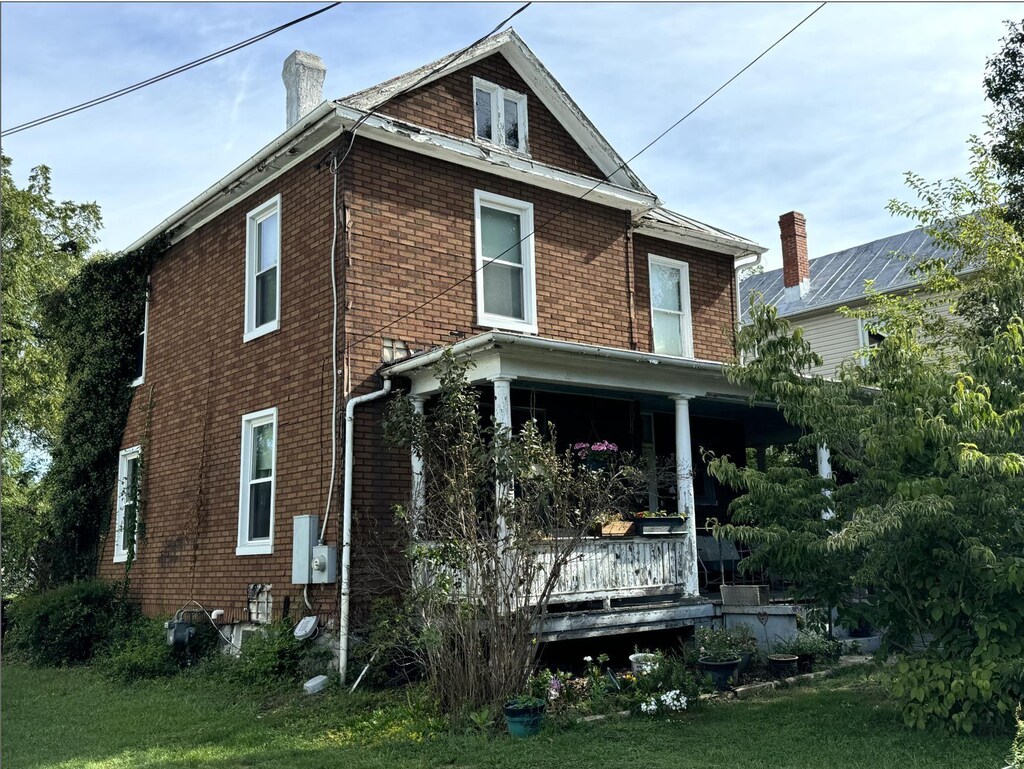 384 Elizabeth St E, Harrisonburg, VA 22802 - rear view of property with a porch, brick siding, and a chimney