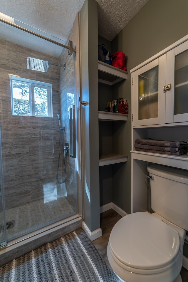 2786 Fleeburg Rd, Shenandoah, VA 22849 - full bathroom featuring a shower stall, toilet, and a textured ceiling