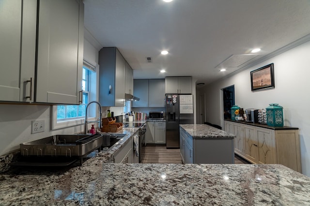 2786 Fleeburg Rd, Shenandoah, VA 22849 - kitchen featuring wood finished floors, refrigerator with ice dispenser, stainless steel microwave, under cabinet range hood, and light stone counters