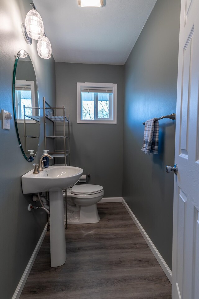 2786 Fleeburg Rd, Shenandoah, VA 22849 - bathroom featuring toilet, baseboards, and wood finished floors