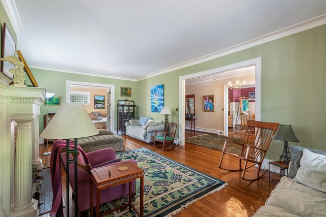 633 Wayne Ave S, Waynesboro, VA 22980 - living room featuring a baseboard heating unit, crown molding, a chandelier, and wood finished floors