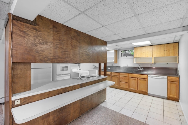 633 Wayne Ave S, Waynesboro, VA 22980 - kitchen with white appliances, washing machine and dryer, a paneled ceiling, light tile patterned flooring, and a sink