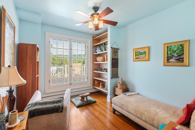 633 Wayne Ave S, Waynesboro, VA 22980 - living area with wood finished floors, baseboard heating, and ceiling fan