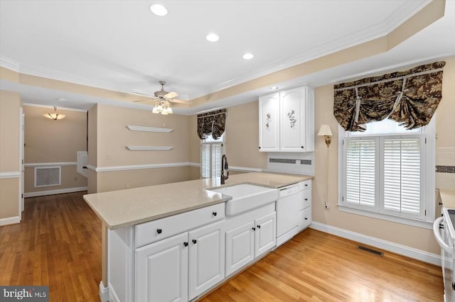 3905 Corbin Hall Ln, Fredericksburg, VA 22408 - kitchen with a peninsula, ornamental molding, ceiling fan, white cabinetry, and a tray ceiling