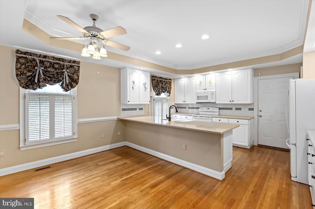 3905 Corbin Hall Ln, Fredericksburg, VA 22408 - kitchen with white appliances, ornamental molding, white cabinetry, light countertops, and light wood-style flooring