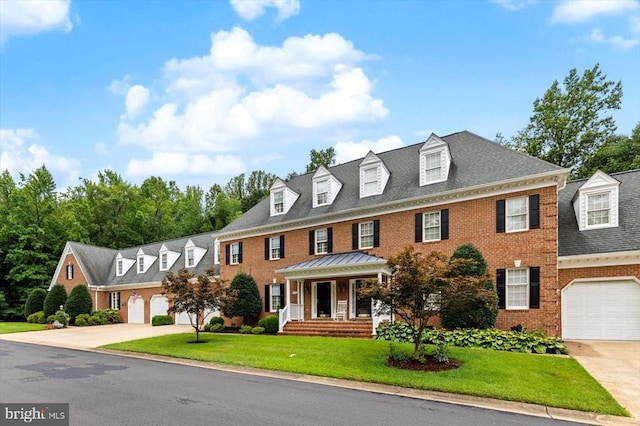 3905 Corbin Hall Ln, Fredericksburg, VA 22408 - colonial inspired home with concrete driveway, brick siding, and a front yard