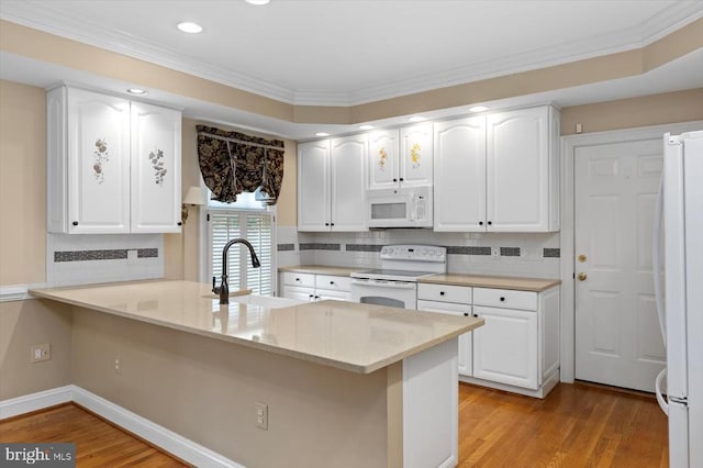 3905 Corbin Hall Ln, Fredericksburg, VA 22408 - kitchen with white appliances, white cabinets, ornamental molding, and recessed lighting