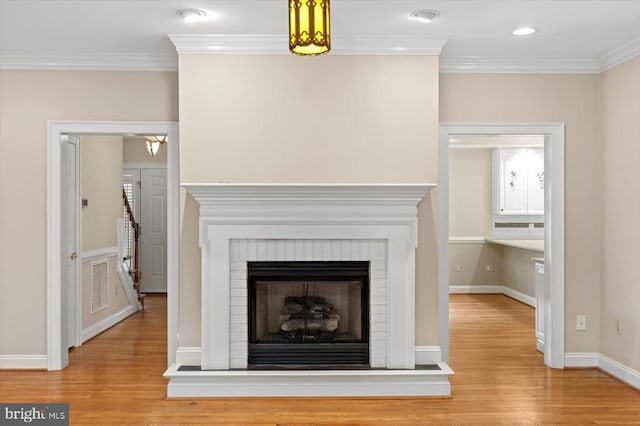 3905 Corbin Hall Ln, Fredericksburg, VA 22408 - detailed view of wood finished floors, crown molding, and a fireplace