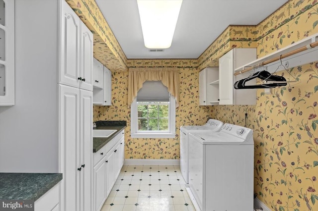 3905 Corbin Hall Ln, Fredericksburg, VA 22408 - laundry room with cabinet space, wallpapered walls, independent washer and dryer, and light floors