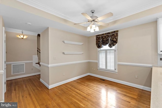 3905 Corbin Hall Ln, Fredericksburg, VA 22408 - empty room featuring wood finished floors, crown molding, a smoke detector, stairs, and ceiling fan