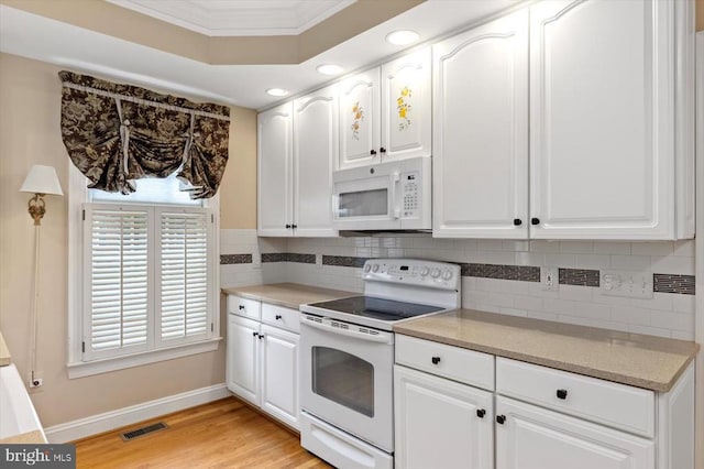 3905 Corbin Hall Ln, Fredericksburg, VA 22408 - kitchen featuring white appliances, tasteful backsplash, white cabinetry, light wood-type flooring, and crown molding