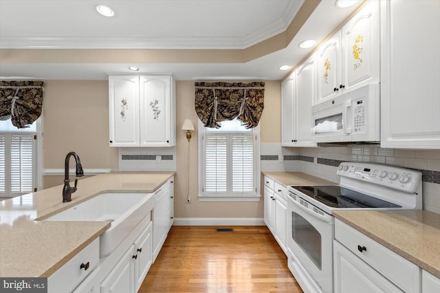 3905 Corbin Hall Ln, Fredericksburg, VA 22408 - kitchen with white appliances, crown molding, decorative backsplash, light wood-type flooring, and recessed lighting