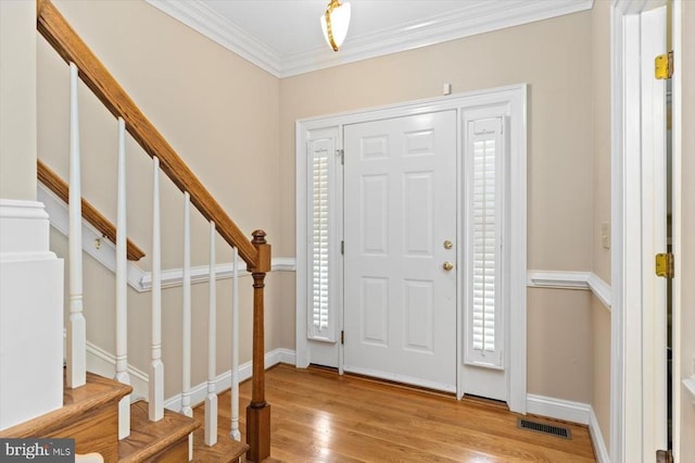 3905 Corbin Hall Ln, Fredericksburg, VA 22408 - entryway with light wood-style floors, crown molding, and stairway