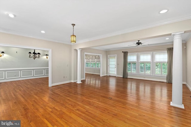 3905 Corbin Hall Ln, Fredericksburg, VA 22408 - unfurnished living room featuring ornate columns, light wood-type flooring, plenty of natural light, crown molding, and recessed lighting