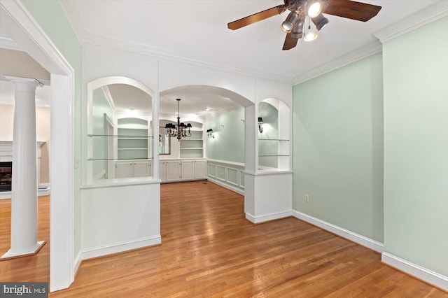 3905 Corbin Hall Ln, Fredericksburg, VA 22408 - unfurnished room featuring ornamental molding, a ceiling fan, wood finished floors, a chandelier, and arched walkways