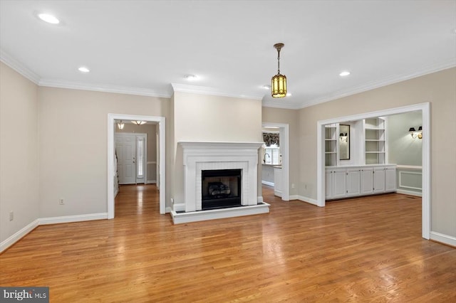 3905 Corbin Hall Ln, Fredericksburg, VA 22408 - unfurnished living room with crown molding, light wood finished floors, a fireplace, and recessed lighting