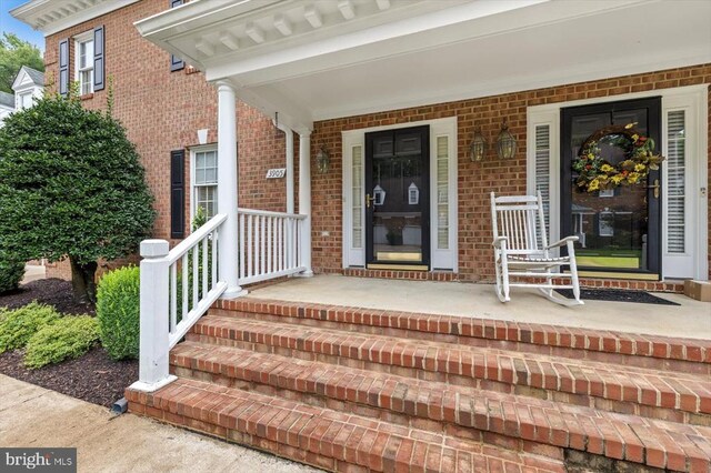 3905 Corbin Hall Ln, Fredericksburg, VA 22408 - property entrance featuring brick siding and covered porch