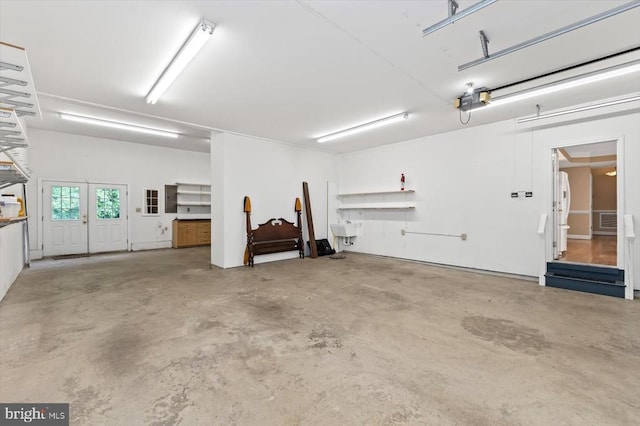 3905 Corbin Hall Ln, Fredericksburg, VA 22408 - garage featuring freestanding refrigerator, french doors, electric panel, and a garage door opener
