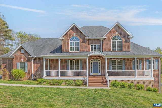1130 Race Ground Rd, Rochelle, VA 22738 - view of front of house featuring a shingled roof, a porch, brick siding, and a front lawn