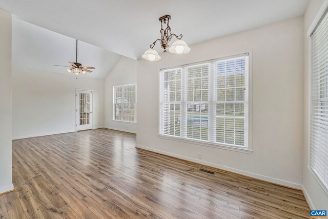 1130 Race Ground Rd, Rochelle, VA 22738 - unfurnished dining area featuring wood finished floors, ceiling fan with notable chandelier, visible vents, baseboards, and lofted ceiling