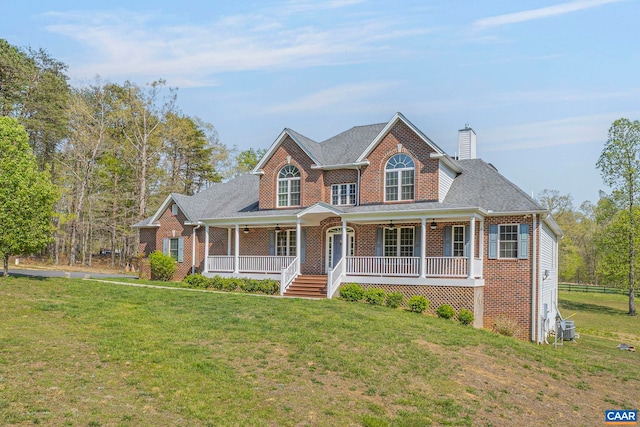 1130 Race Ground Rd, Rochelle, VA 22738 - view of front of property featuring ceiling fan, brick siding, covered porch, and a front yard