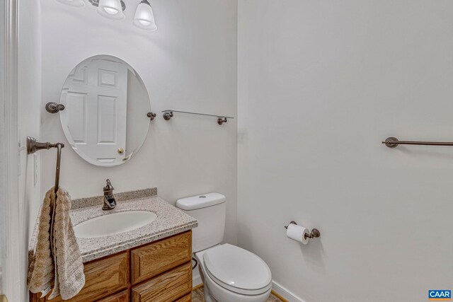 1130 Race Ground Rd, Rochelle, VA 22738 - bathroom featuring toilet, baseboards, and vanity