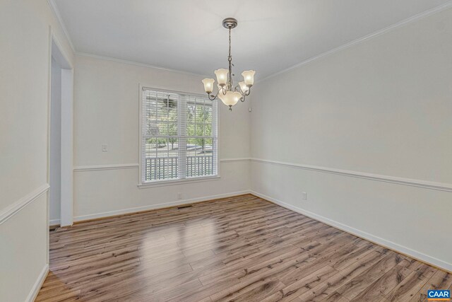 1130 Race Ground Rd, Rochelle, VA 22738 - unfurnished room with crown molding, wood finished floors, baseboards, and a notable chandelier