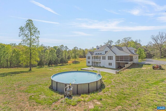 1130 Race Ground Rd, Rochelle, VA 22738 - outdoor pool featuring a lawn, a forest view, and a sunroom