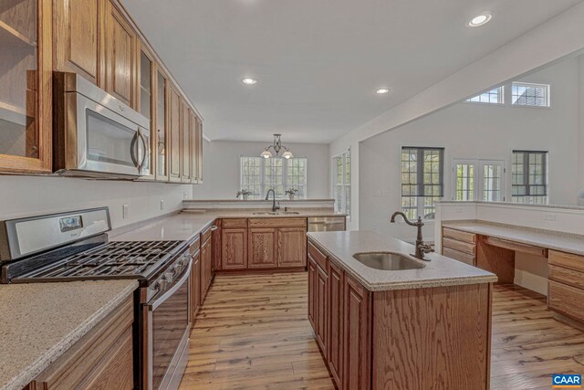 1130 Race Ground Rd, Rochelle, VA 22738 - kitchen featuring a sink, light wood-style flooring, light countertops, and appliances with stainless steel finishes