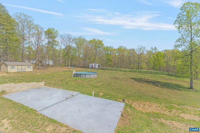 1130 Race Ground Rd, Rochelle, VA 22738 - view of yard with a patio area, an outbuilding, an outdoor pool, and fence
