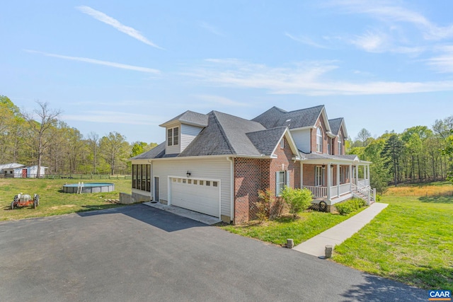 1130 Race Ground Rd, Rochelle, VA 22738 - view of side of property featuring a lawn, brick siding, an attached garage, a porch, and aphalt driveway