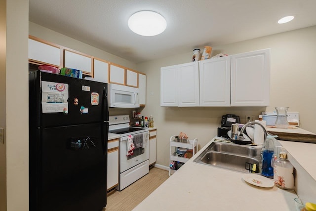 510 Davis Mills Dr Unit 103, Harrisonburg, VA 22801 - kitchen with white appliances, a sink, white cabinets, light wood-style floors, and light countertops