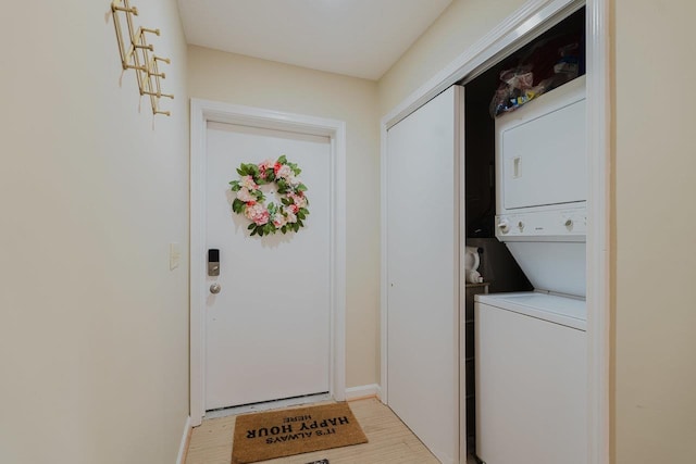 510 Davis Mills Dr Unit 103, Harrisonburg, VA 22801 - laundry area with stacked washing machine and dryer, light wood-style floors, and baseboards