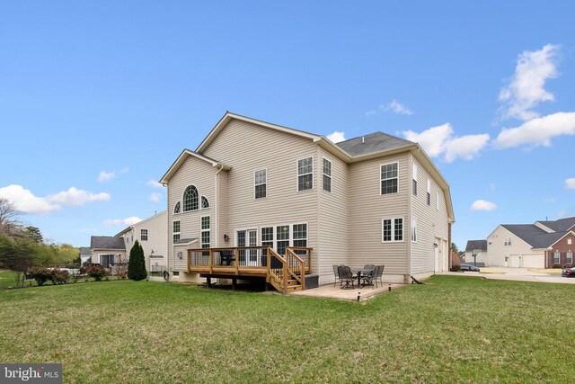 5831 Deep Creek Dr, Fredericksburg, VA 22407 - back of property featuring a deck, a yard, and a patio area
