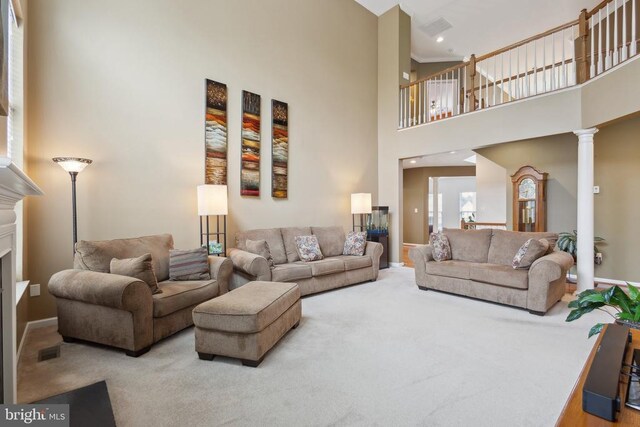5831 Deep Creek Dr, Fredericksburg, VA 22407 - carpeted living room with a high ceiling, baseboards, ornate columns, and a fireplace