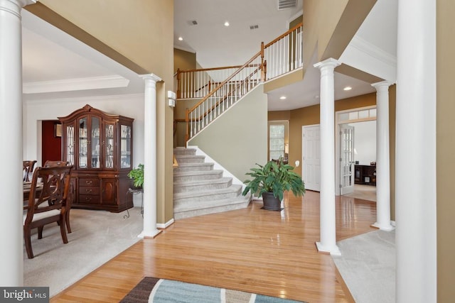5831 Deep Creek Dr, Fredericksburg, VA 22407 - foyer with ornate columns, crown molding, wood finished floors, recessed lighting, and baseboards