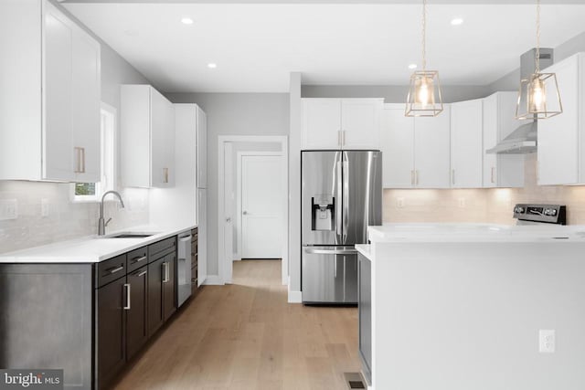 10643 Settle School Rd, Rixeyville, VA 22737 - kitchen with a sink, white cabinetry, light wood-type flooring, and appliances with stainless steel finishes