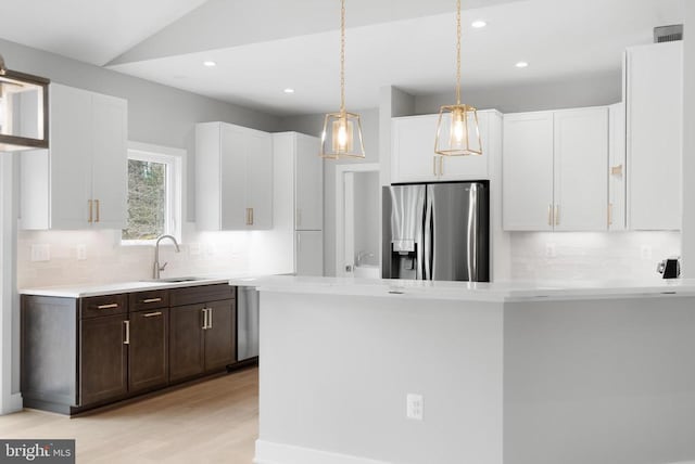 10643 Settle School Rd, Rixeyville, VA 22737 - kitchen featuring a sink, white cabinetry, stainless steel fridge with ice dispenser, backsplash, and light countertops