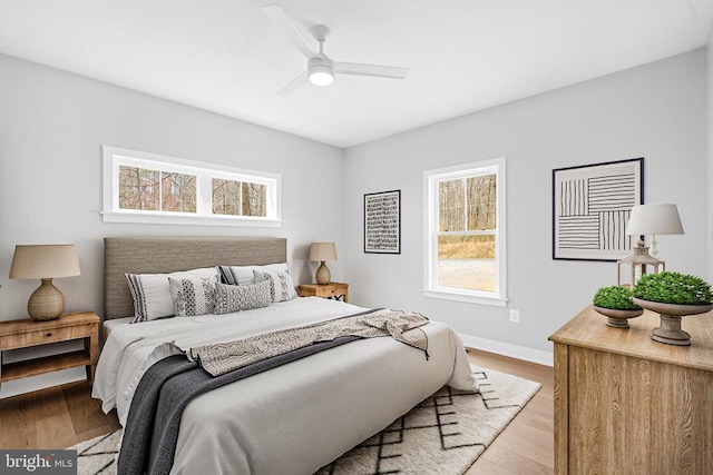 10643 Settle School Rd, Rixeyville, VA 22737 - bedroom with baseboards, multiple windows, ceiling fan, and wood finished floors