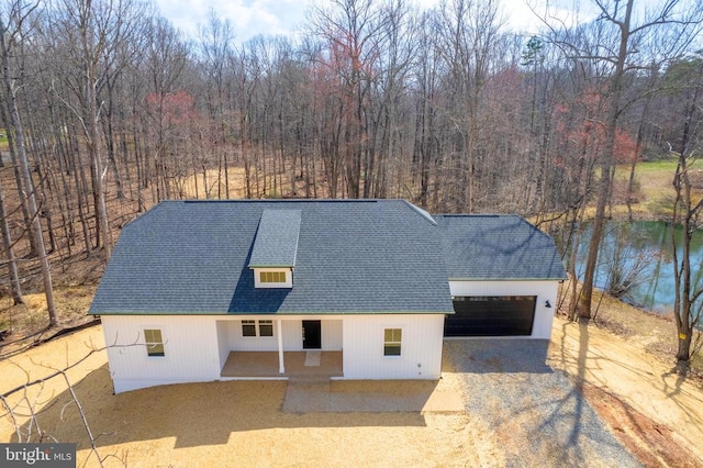 10643 Settle School Rd, Rixeyville, VA 22737 - view of front of home with roof with shingles, dirt driveway, an attached garage, and a view of trees